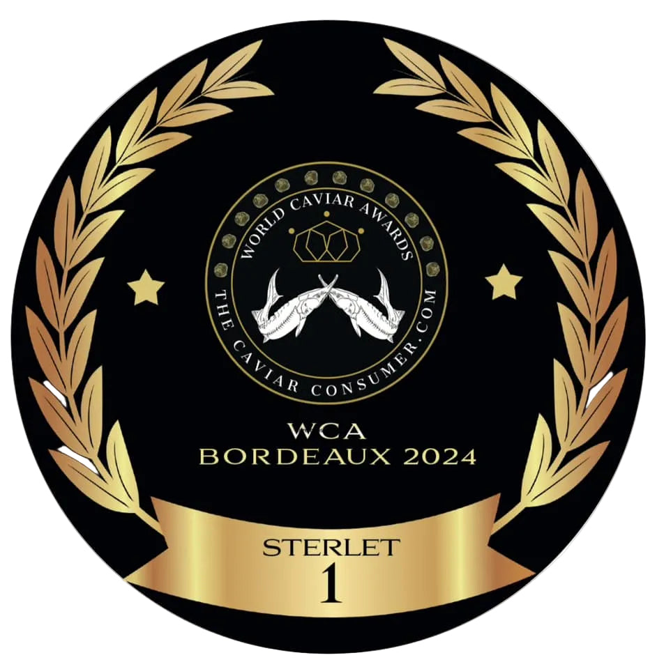 Round black and gold emblem for WCA Bordeaux 2024 with laurel wreath and caviar consumer logo.